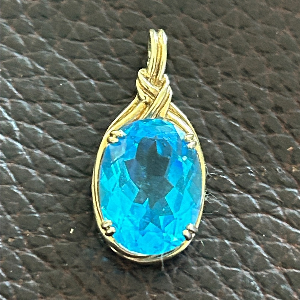 Topaz Pendant set in 10 k gold stone tested on pentium stone tester